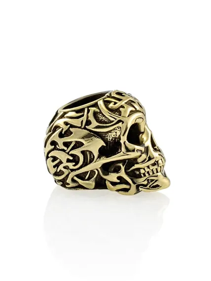 Картинка одного бронзового шарма Tribal Skull, вид в анфас справа.