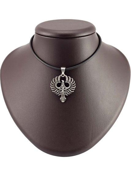 Купите кулон Феникс из серебра 925 пробы, фото на постаменте.