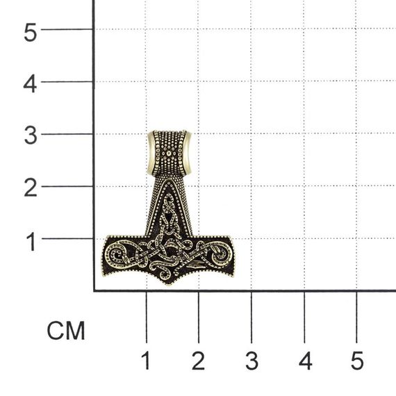 Фотография кулона молот Тора малый из бронзы на размерной сетке.