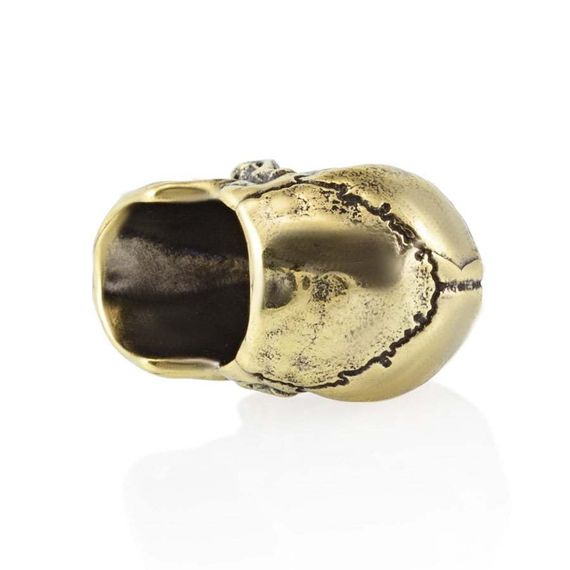 Картинка бронзовой бусины для темляка, вид на боку с частично видимым отверстием.