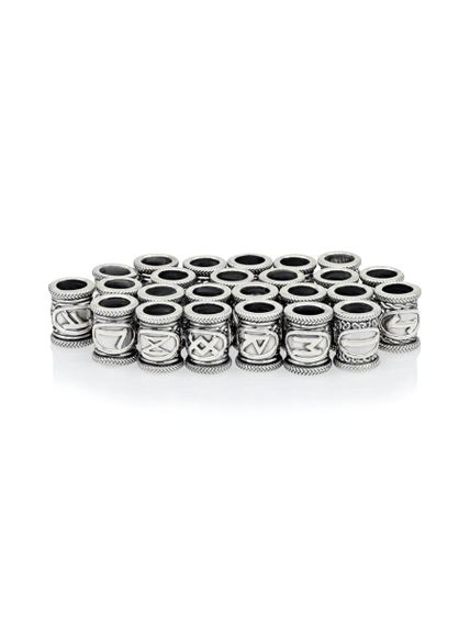 Фотография набор рун 25 штук из серебра 925 пробы на столе развернутый вид.