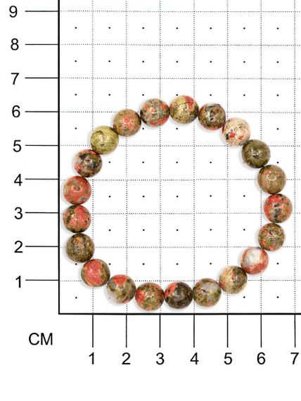 Фото браслета из яшмы унакит на белом фоне вид на размерной сетке