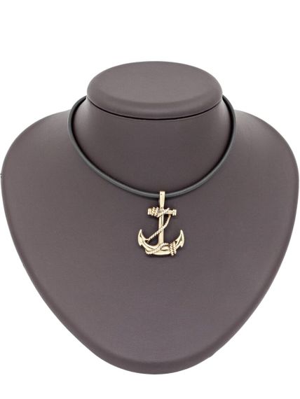 Фото подвески якорь из бронзы, вид на постаменте.