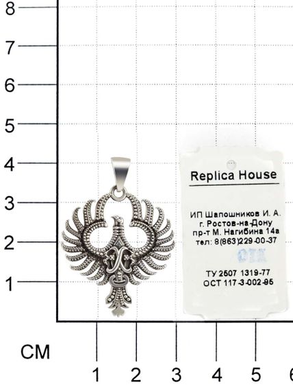 Кулон птица Феникс из серебра фото на размерной сетке.