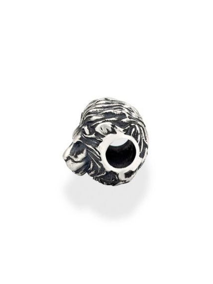 Шарм Лев малый из серебра, вид сбоку повёрнут влево