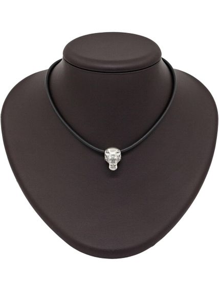 Фото на постаменте головы тигра из серебра.