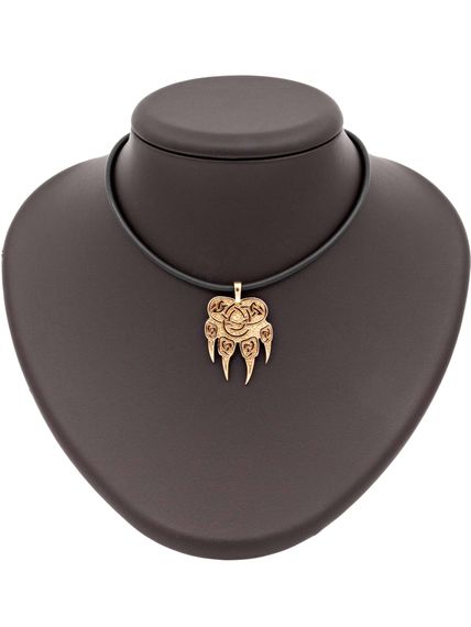 Фото подвески печать Велеса волчья лапа из серебра с позолотой на постаменте