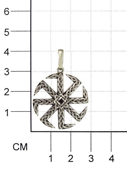 Фотография Коловрата и звезда Руси из мельхиора на размерной сетке в масштабе.